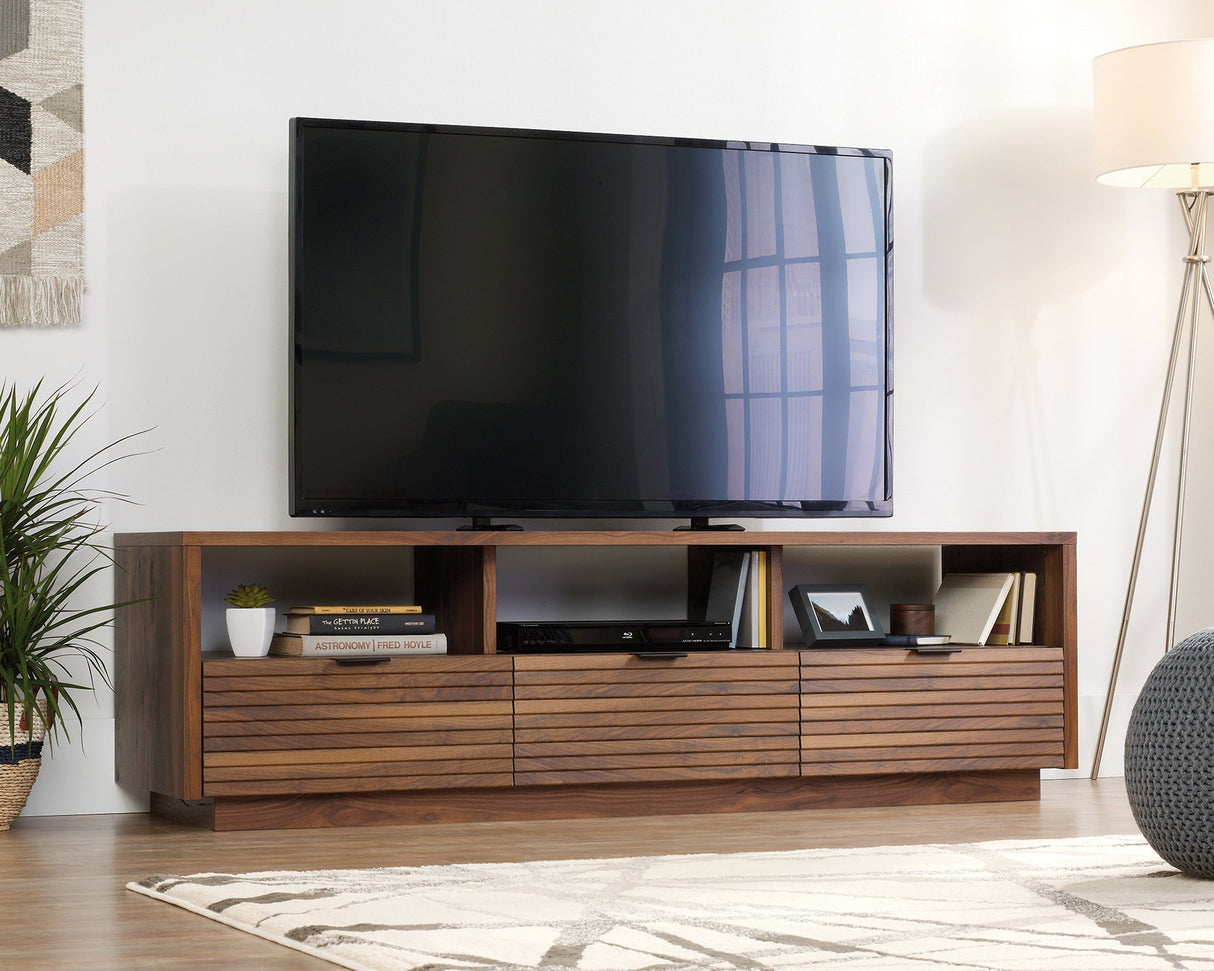 Mid-century modern TV stand in Grand Walnut with slatted drawers in living room setting